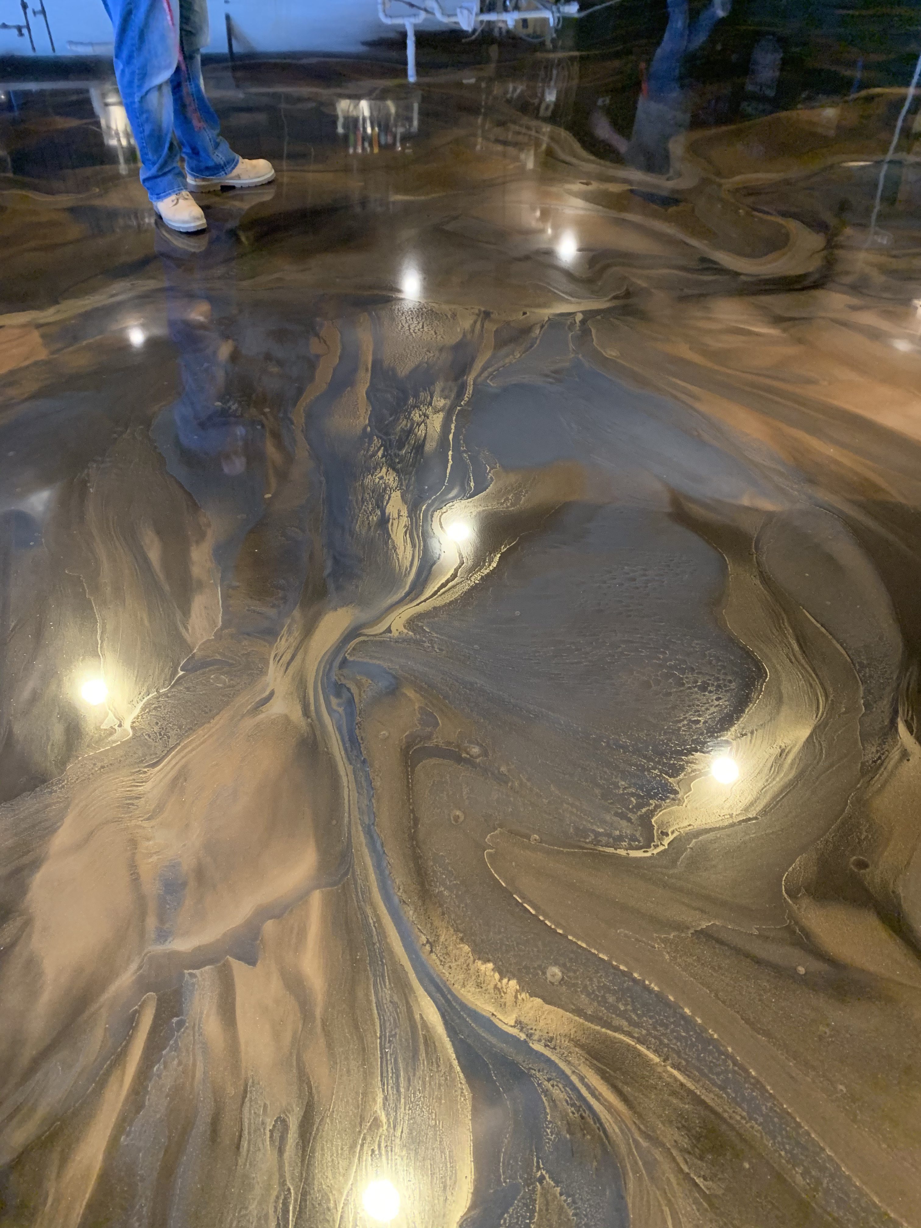 Dark gold metallic epoxy flooring in a residential setting